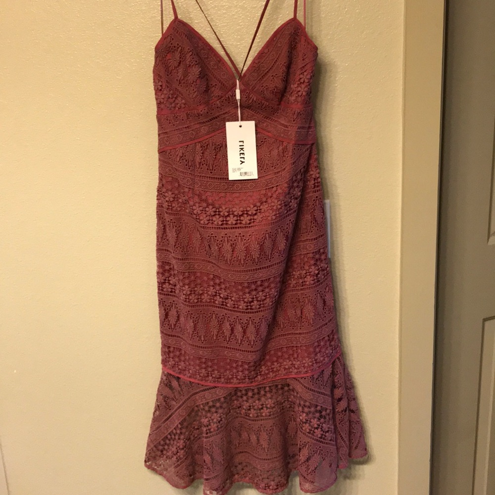 Light burgundy/mauve mid length dress.